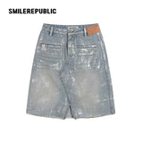 Denim Blue Metallic Coated Washed Denim Skirt with Asymmetric Front Slit and Raw Hem for Women