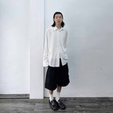 Side-Studded Pleated Baggy Shorts