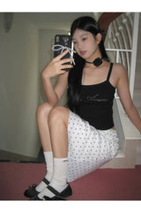 Marshmallow beaded black sleeveless top
