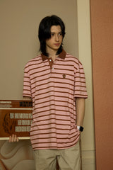 Brown Leather Academic Cap C Patch Pink Stripe Polo Short Sleeve Tee [Unisex]
