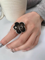Black flower point ring