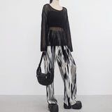 yellow-colored patterned pants