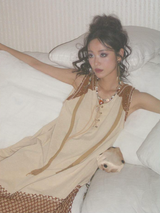 A long, loose and slimming knitted dress for a niche market.