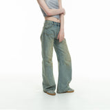 curved-cut mud-dyed jeans