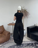 Pale studded strap pants