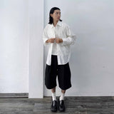Side-Studded Pleated Baggy Shorts