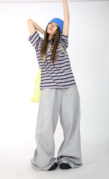 over wide gray pants
