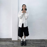 Side-Studded Pleated Baggy Shorts