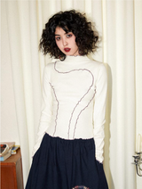 A slim-fit, color-blocked, close-knit turtleneck base layer shirt with a versatile Cuban collar and long sleeves.