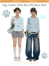 BETWEENAND summer shirt with mint blue stripes, diamond-encrusted waistline, and short sleeves