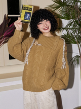 Relaxed and retro collarless sweater with a laid-back vibe