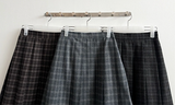 Bomi A-line pleated check midi skirt 