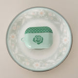 Rose polka-dot glossy blue and green airPods case