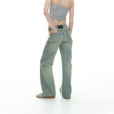 curved-cut mud-dyed jeans