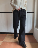 Curden Diagonal Cut Curved Bootcut Pants