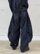RELABEL Spatial Relations (Velvet Flowers) Muscular Line Segmentation Flocked Curved Blade Silhouette Dual-Form Denim Trousers