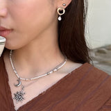 Circle drop earring