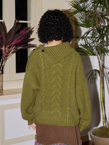 Relaxed and retro collarless sweater with a laid-back vibe
