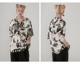 Cuban-style loose and breathable short-sleeved shirt with black and white portrait blur print.