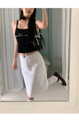 Marshmallow beaded black sleeveless top
