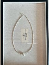 Irregularly shaped silver pearl necklace