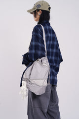 Winding zip up drawstring cross bag