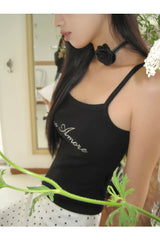 Marshmallow beaded black sleeveless top