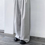 ミストグレーアシンメトリープリーツトラウザーズ