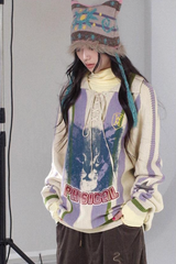 Loose lapel, raglan sleeve, color-blocked striped, cut-out printed sweater