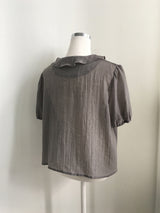 Cascade ruffle blouse