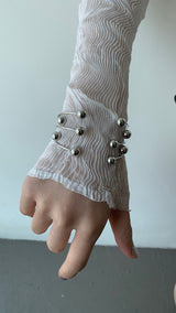 Silver ball piercing bangle