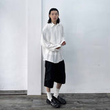 Side-Studded Pleated Baggy Shorts
