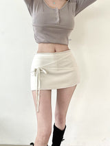 1438. Cross strap ribbon mini sk (2color)