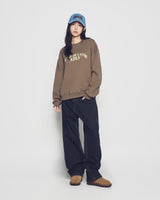 25FW WOMAN アーチシェイプドロゴナッピングスウェットシャツ