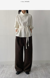 High-neck belted balloon-fit blouse