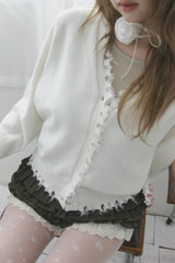 Rough damaged cardigan