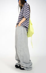 over wide gray pants