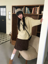 トゥゴーツイストハーフトッポッキボタンフードニット