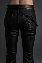 COATED BLACK BOOTS CUT DENIM