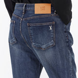 シグネチャースタッドテーパードクロップフィットデニムパンツ