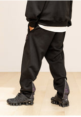 グレーティングエンブレムバックスリットジップパンツ / GRATING EMBLEM BACK SLIT ZIP PANTS