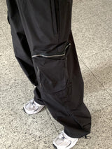 アコンジッパーポケットナイロンワイドツーウェイジョガーパンツ/ Acorn Zip Pocket Nylon Wide Two Way Joggers