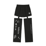 0 7 cut out emoji pants - BLACK