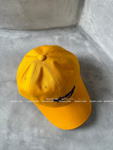 Yellow lettering ball cap